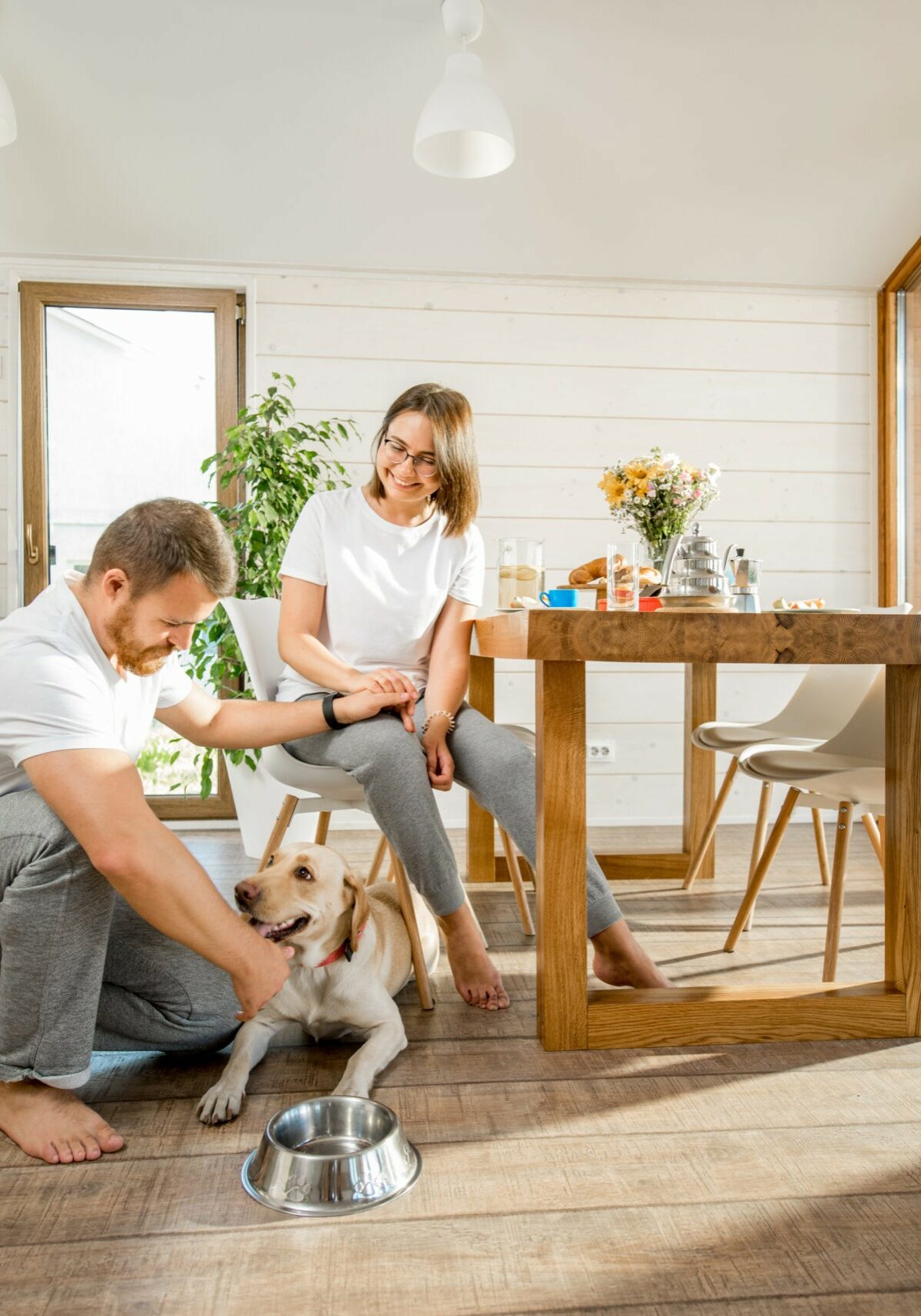 Young couple with dog at home | Floor to Ceiling - Littleton
